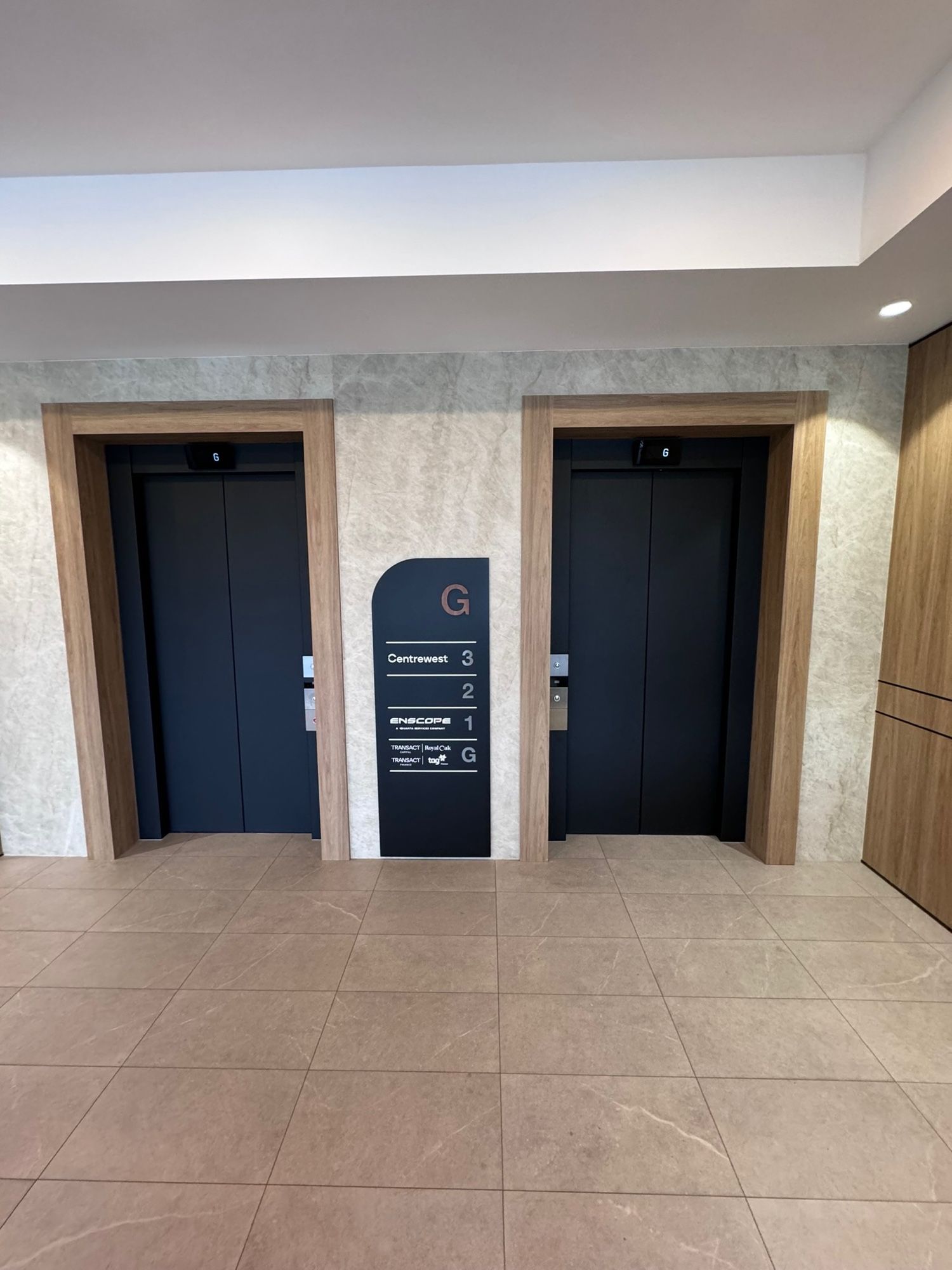 After: Lobby lift doors, stainless to matte black