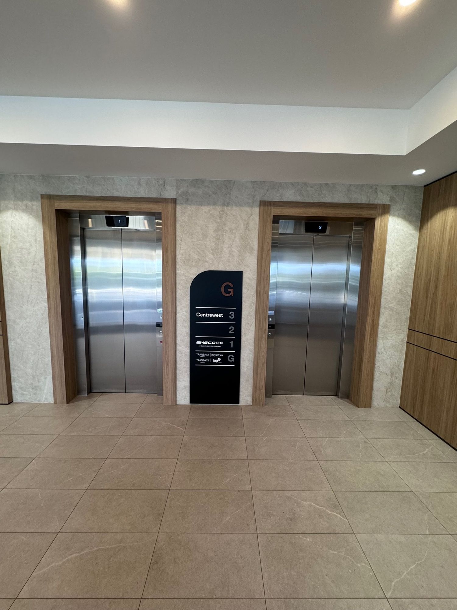 Before: Lobby lift doors, stainless to matte black