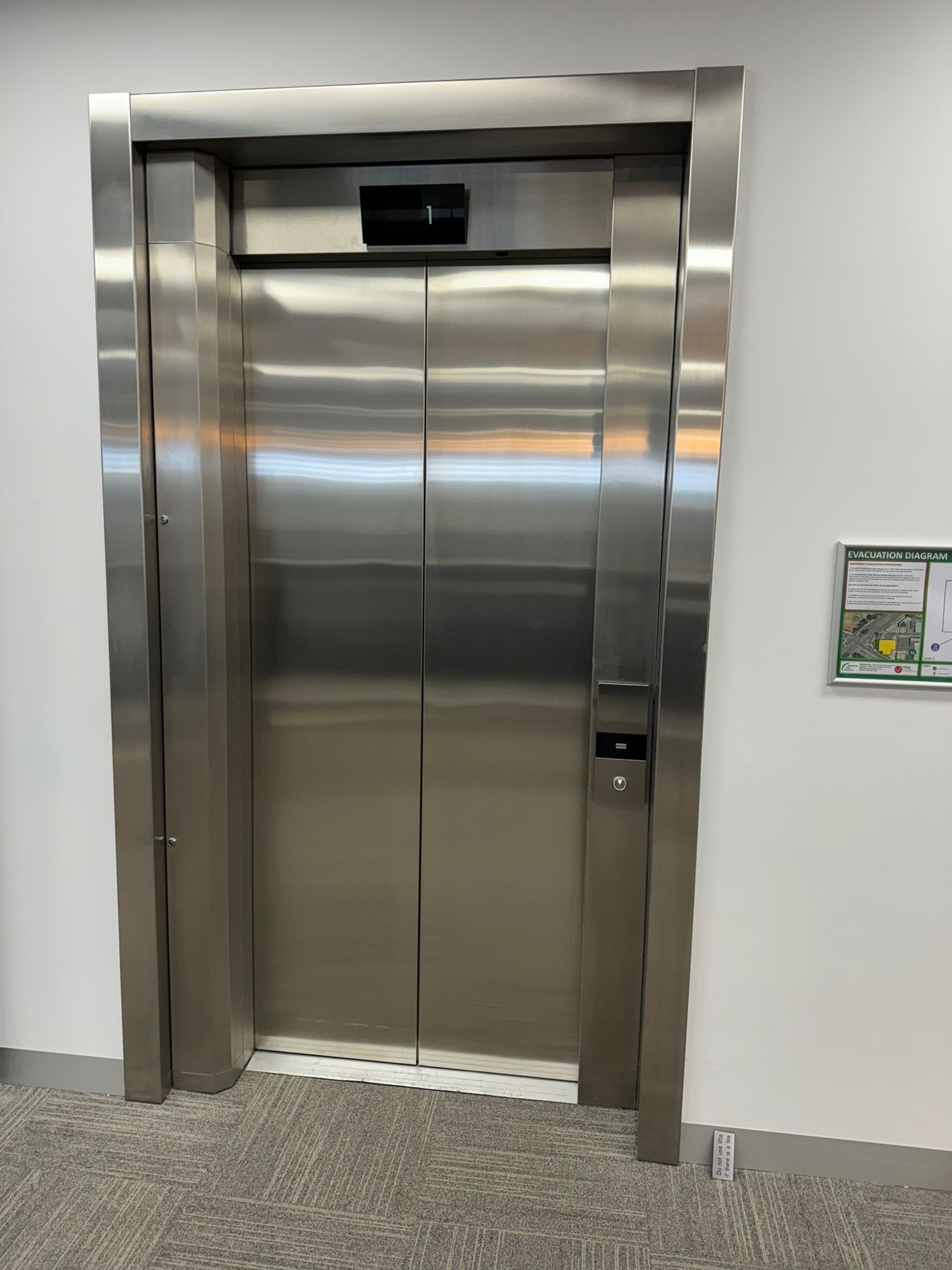 Before: Lift doors and surround, stainless to matte black