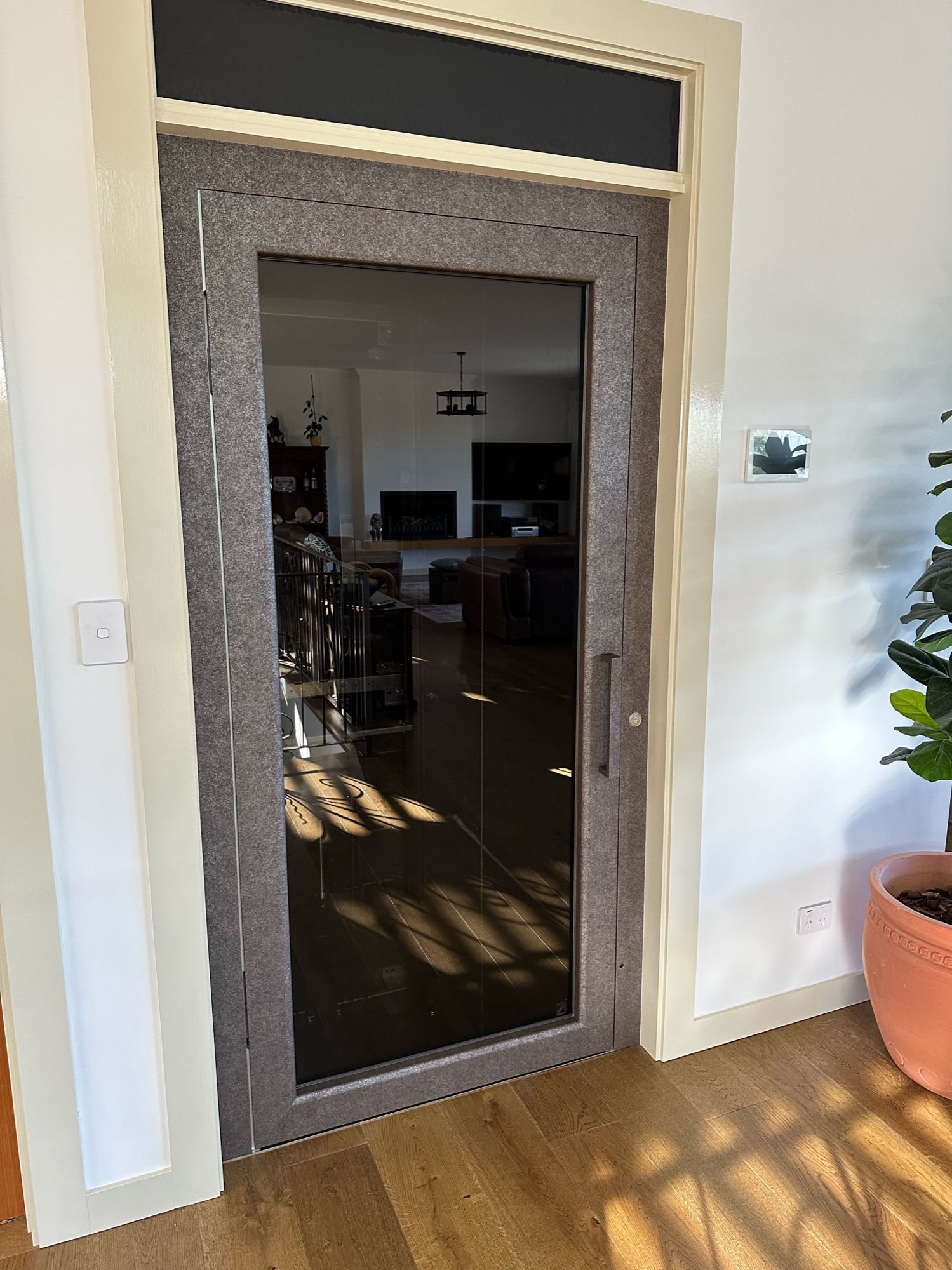After: Home lift door frame, white to dark stone look