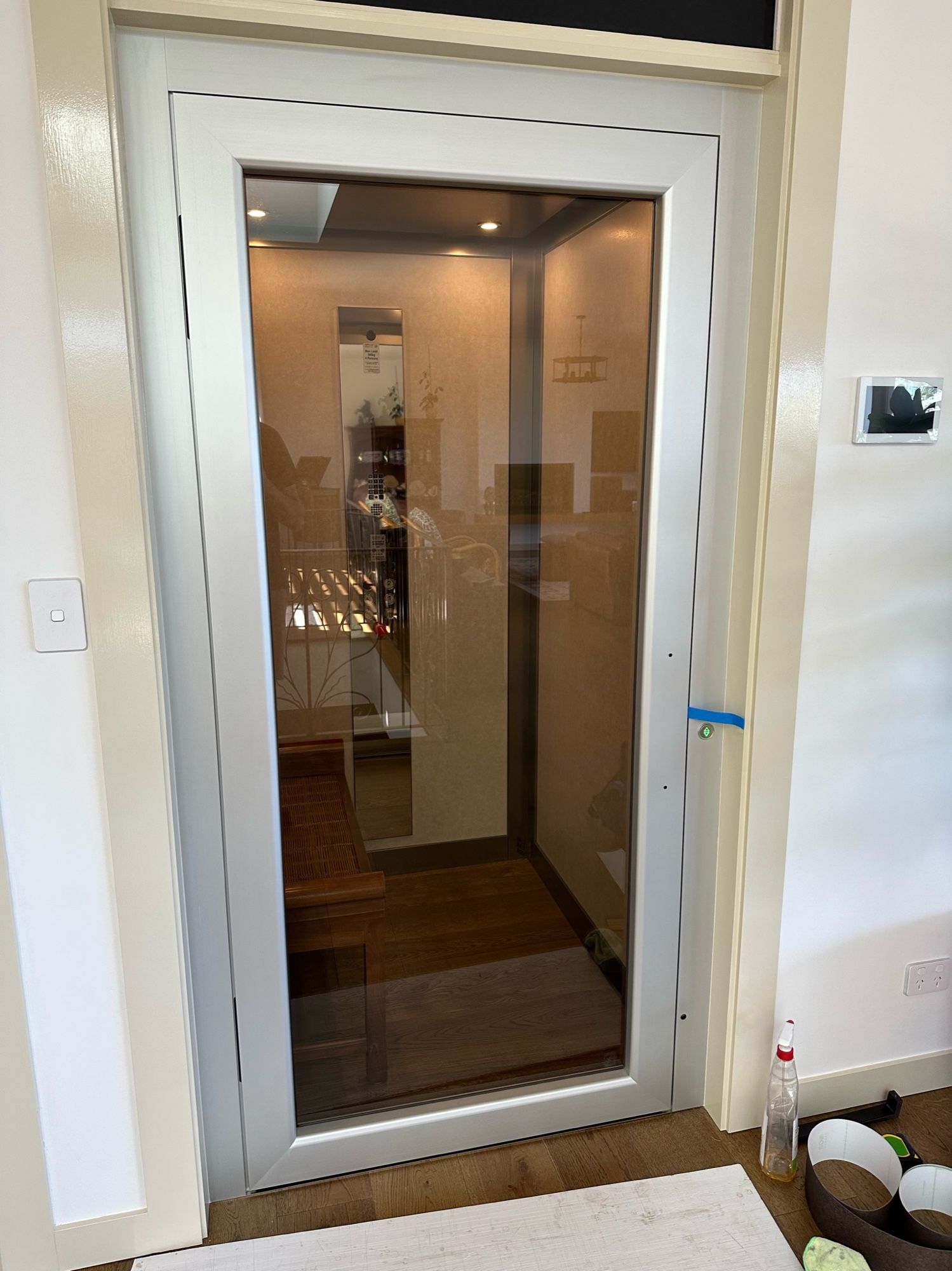 Before: Home lift door frame, white to dark stone look