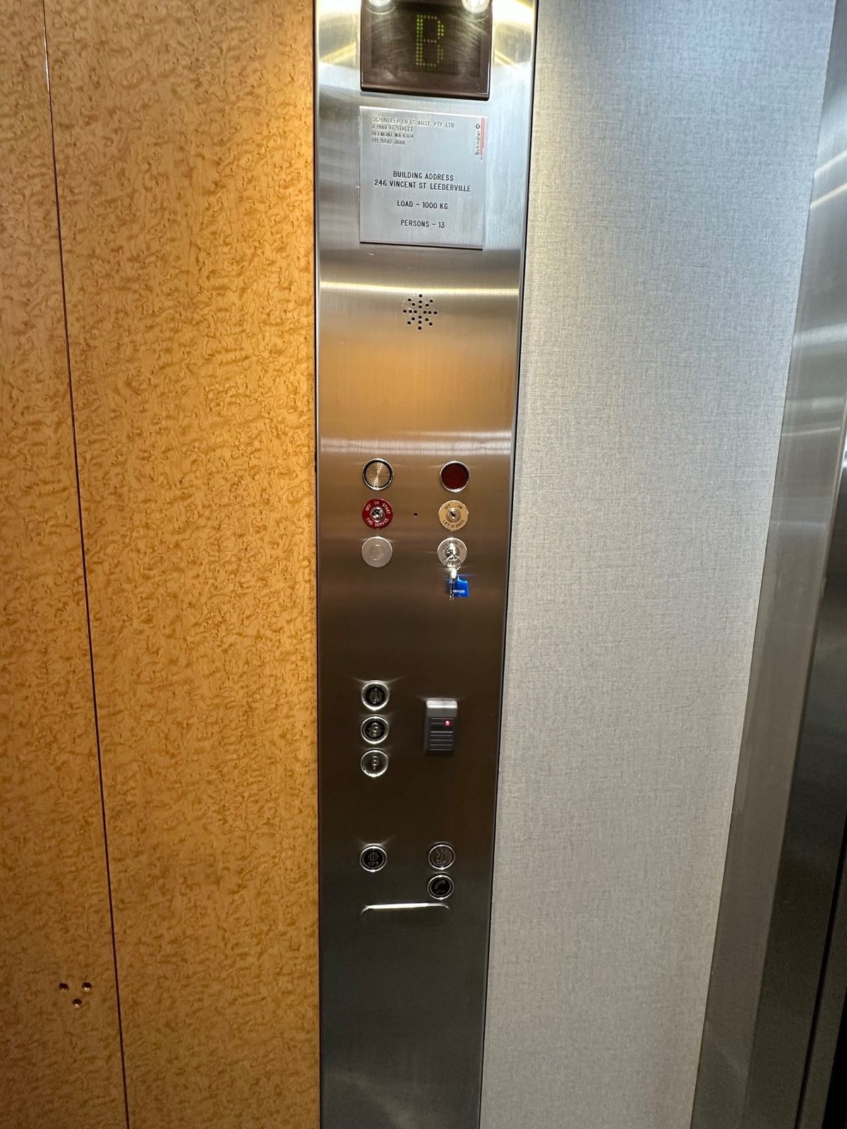 Installation in progress: Lift car, orange timber to pale linen