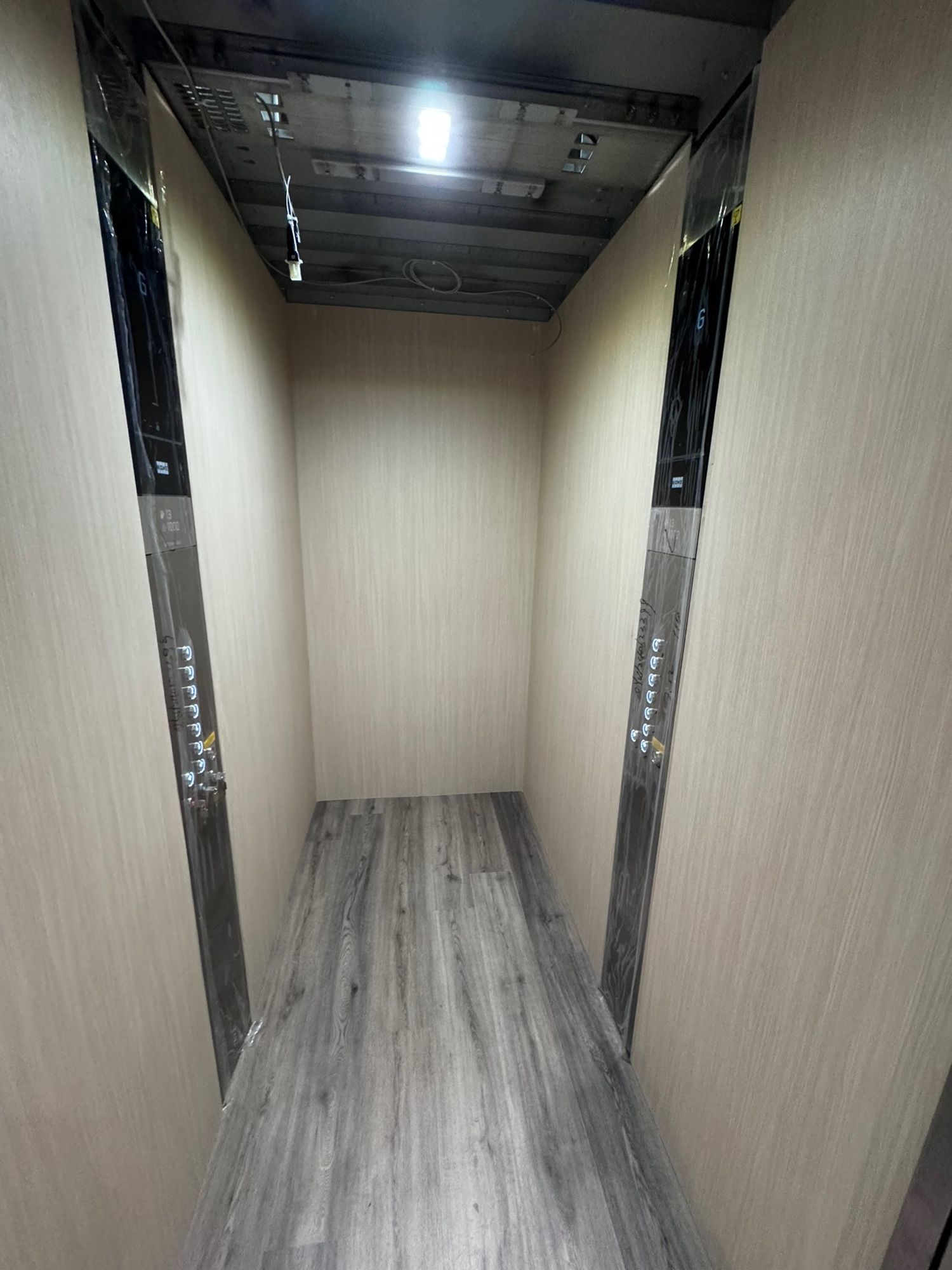 After: Lift car, raw plywood to light woodgrain
