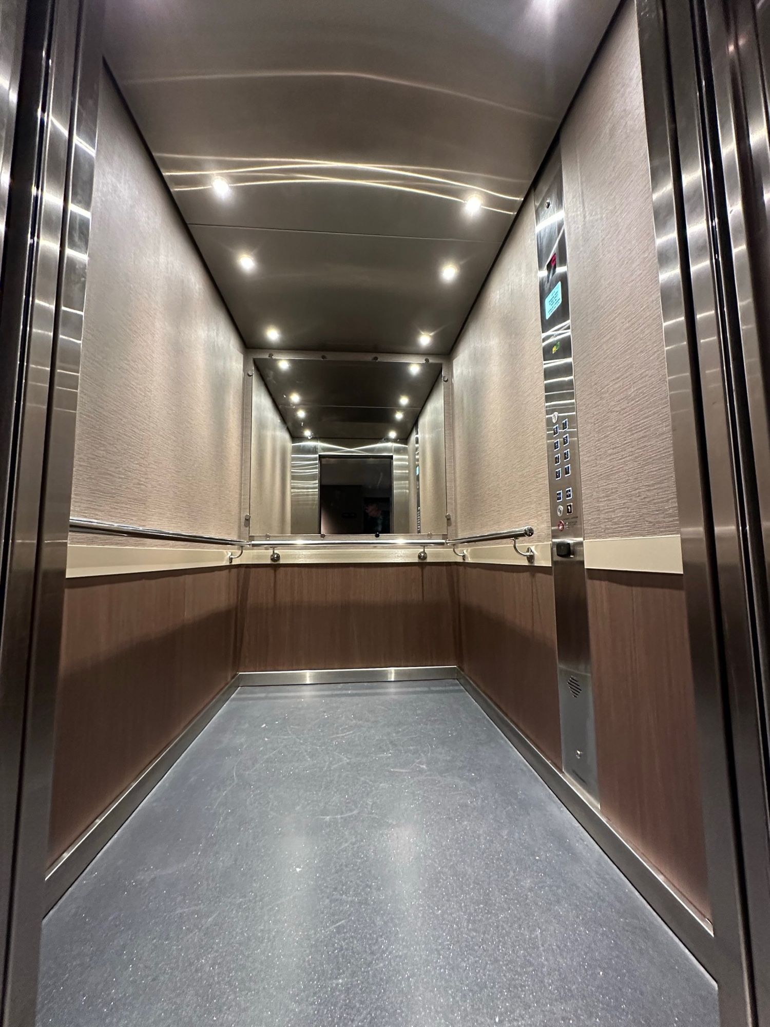 After: Lift car, stainless to linen with a timber dado