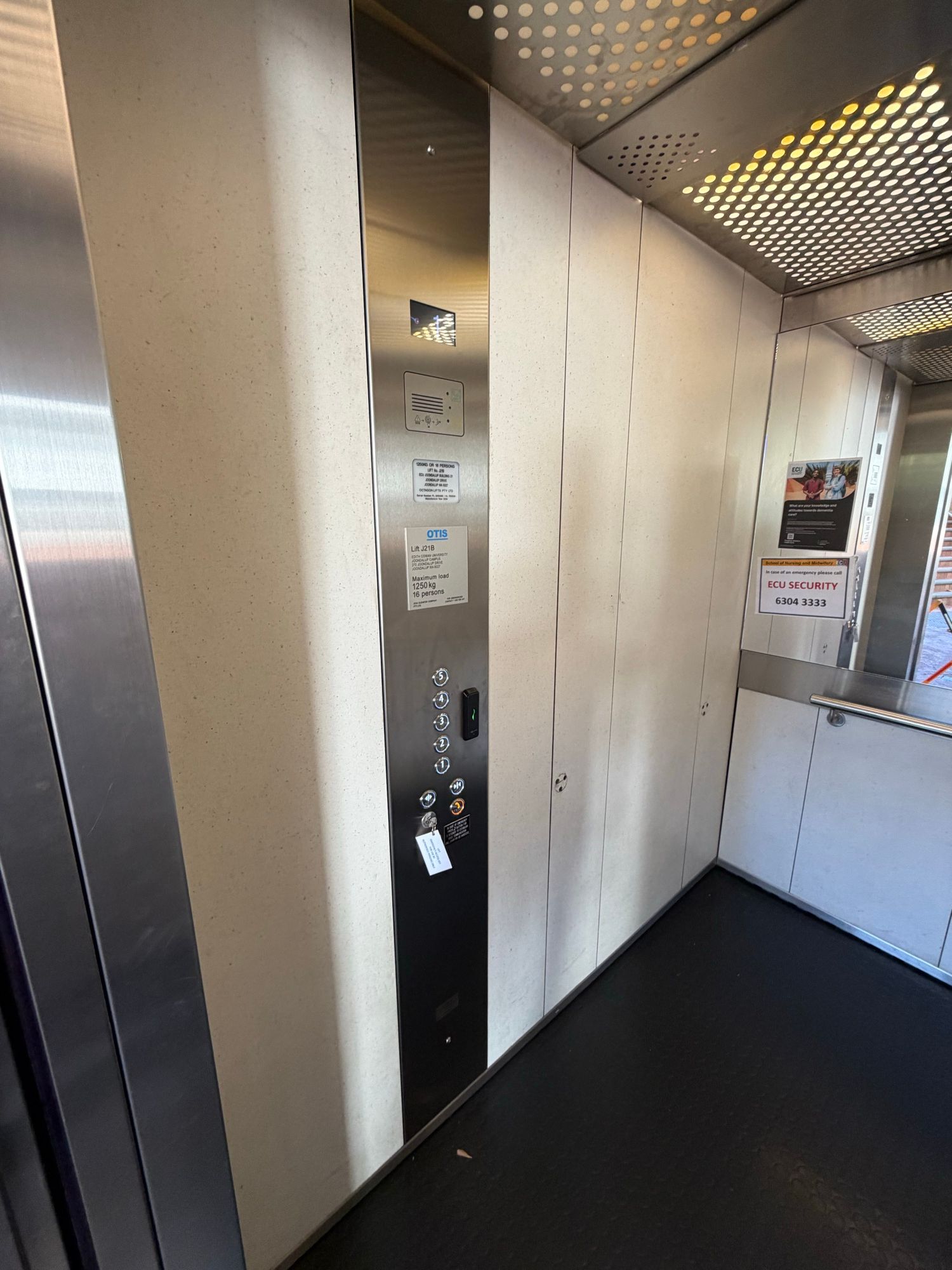 Before: Lift car, cream panels to dark woodgrain