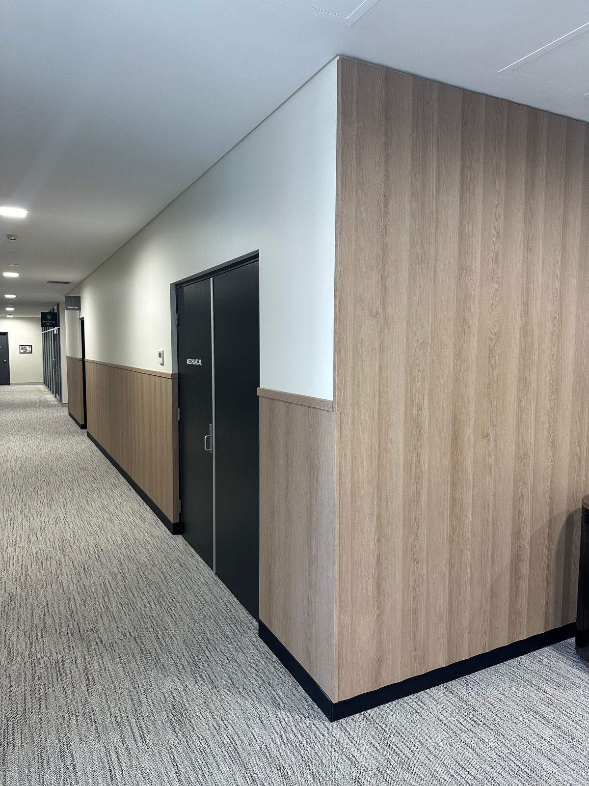 Installation in progress: Lift lobby, stainless doors to oak-look walls