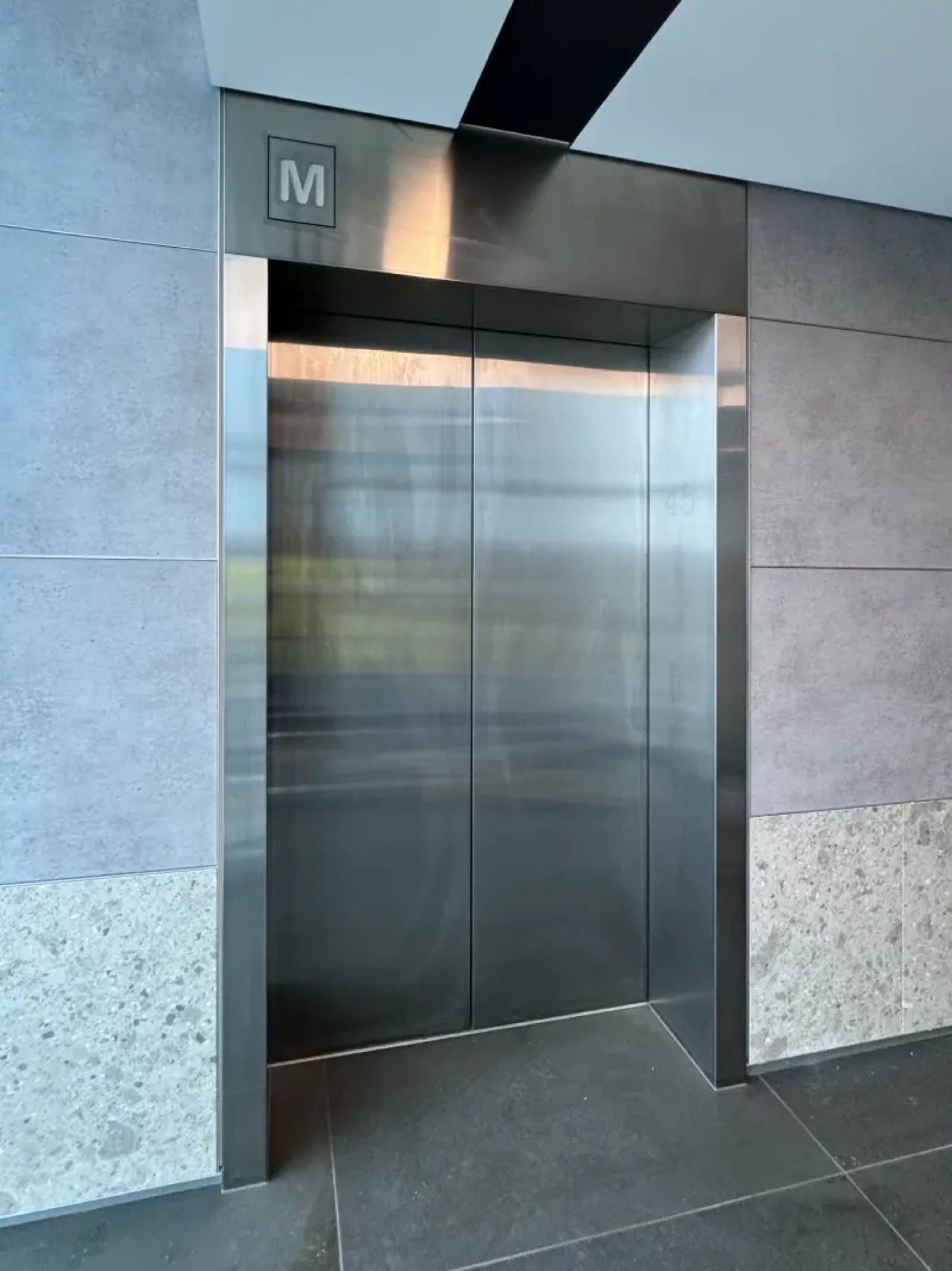 Before: Lift doors and frame, stainless to timber woodgrain