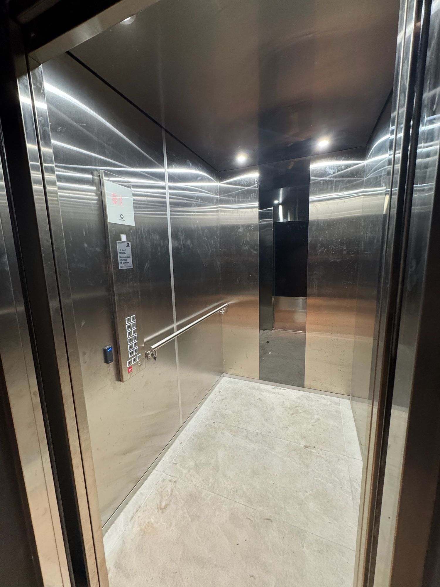 Before: Lift car, stainless to walnut woodgrain
