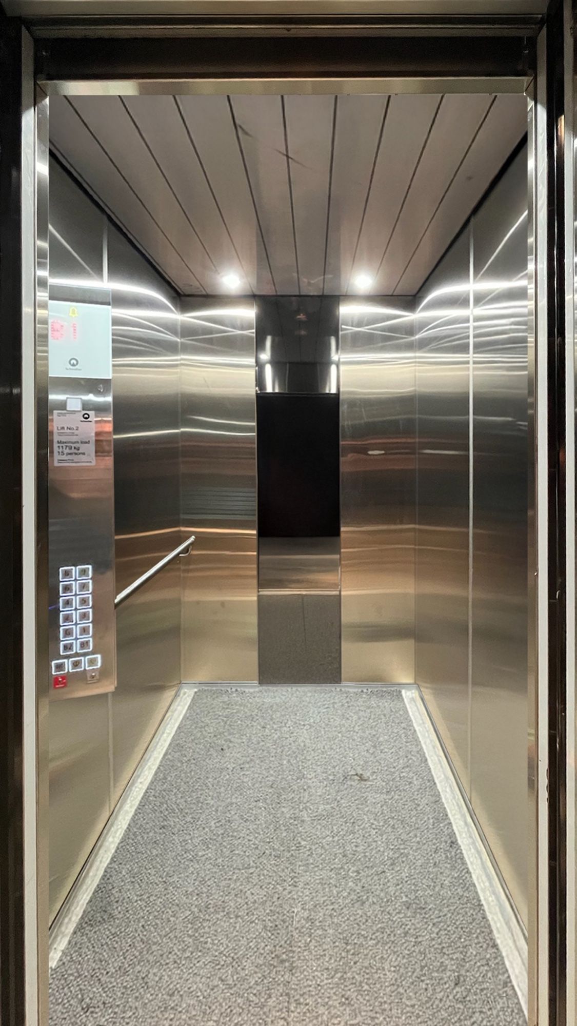 Before: Lift car, stainless to walnut woodgrain