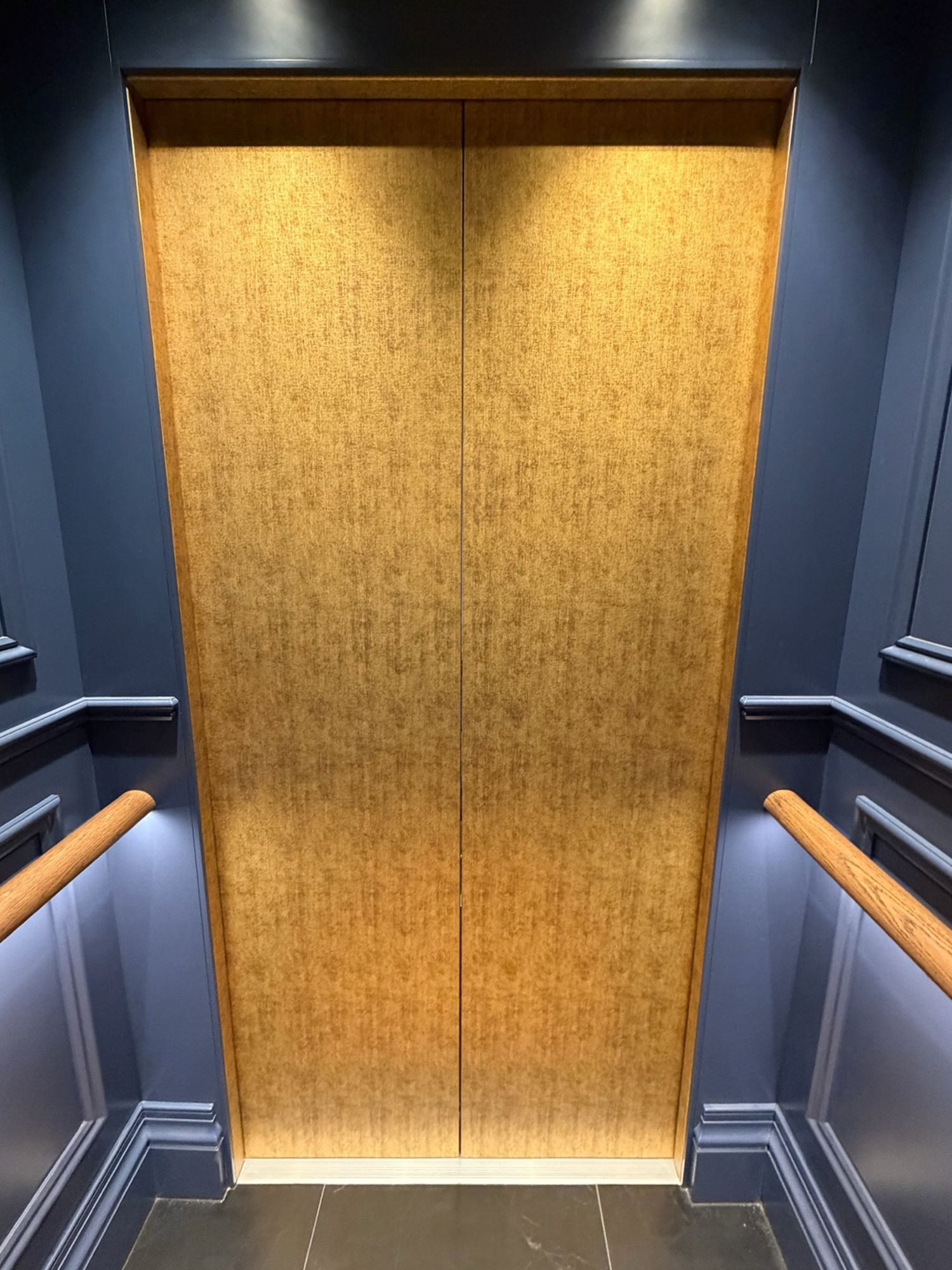 After: Lift doors, stainless to textured gold