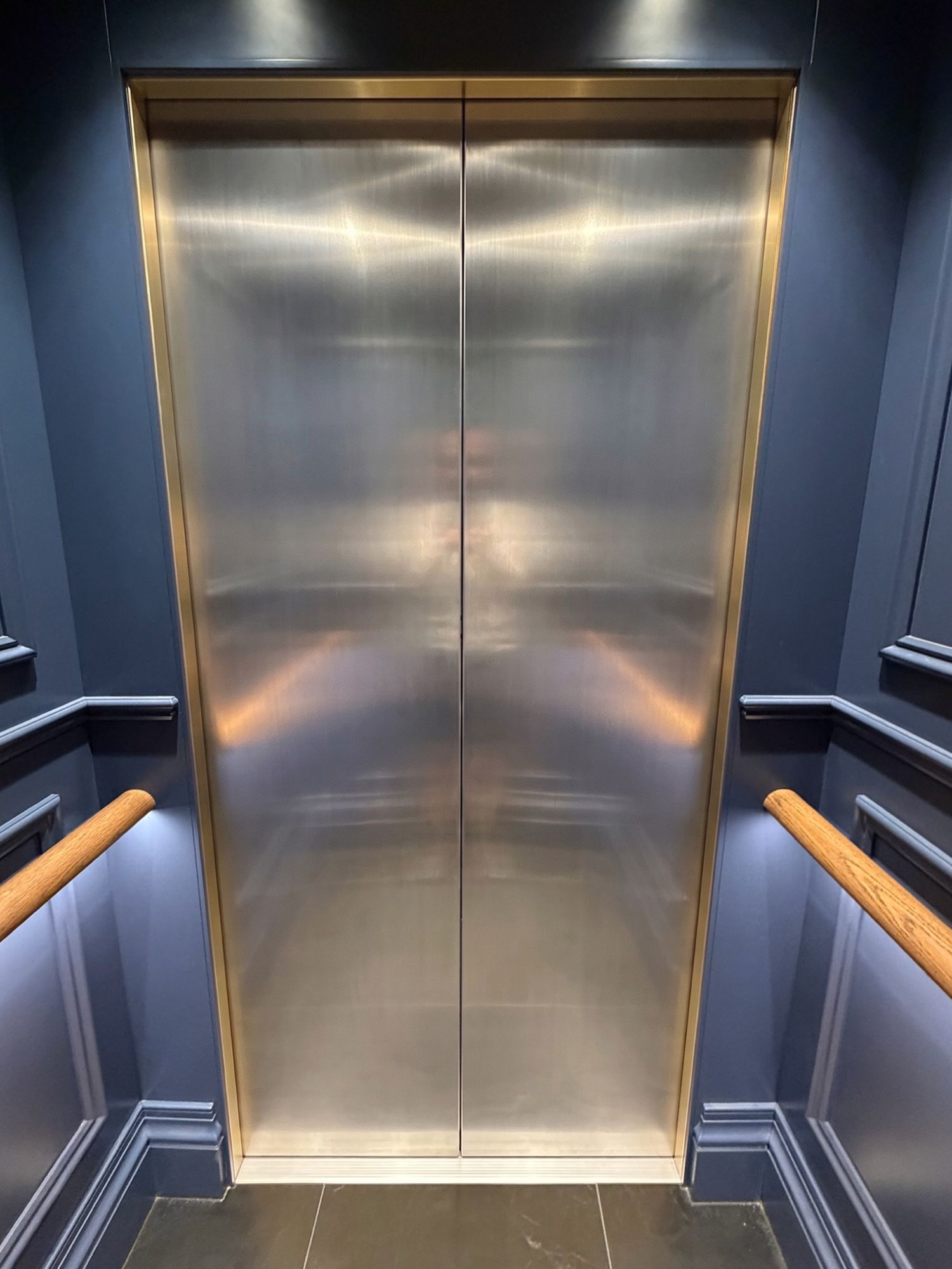 Before: Lift doors, stainless to textured gold