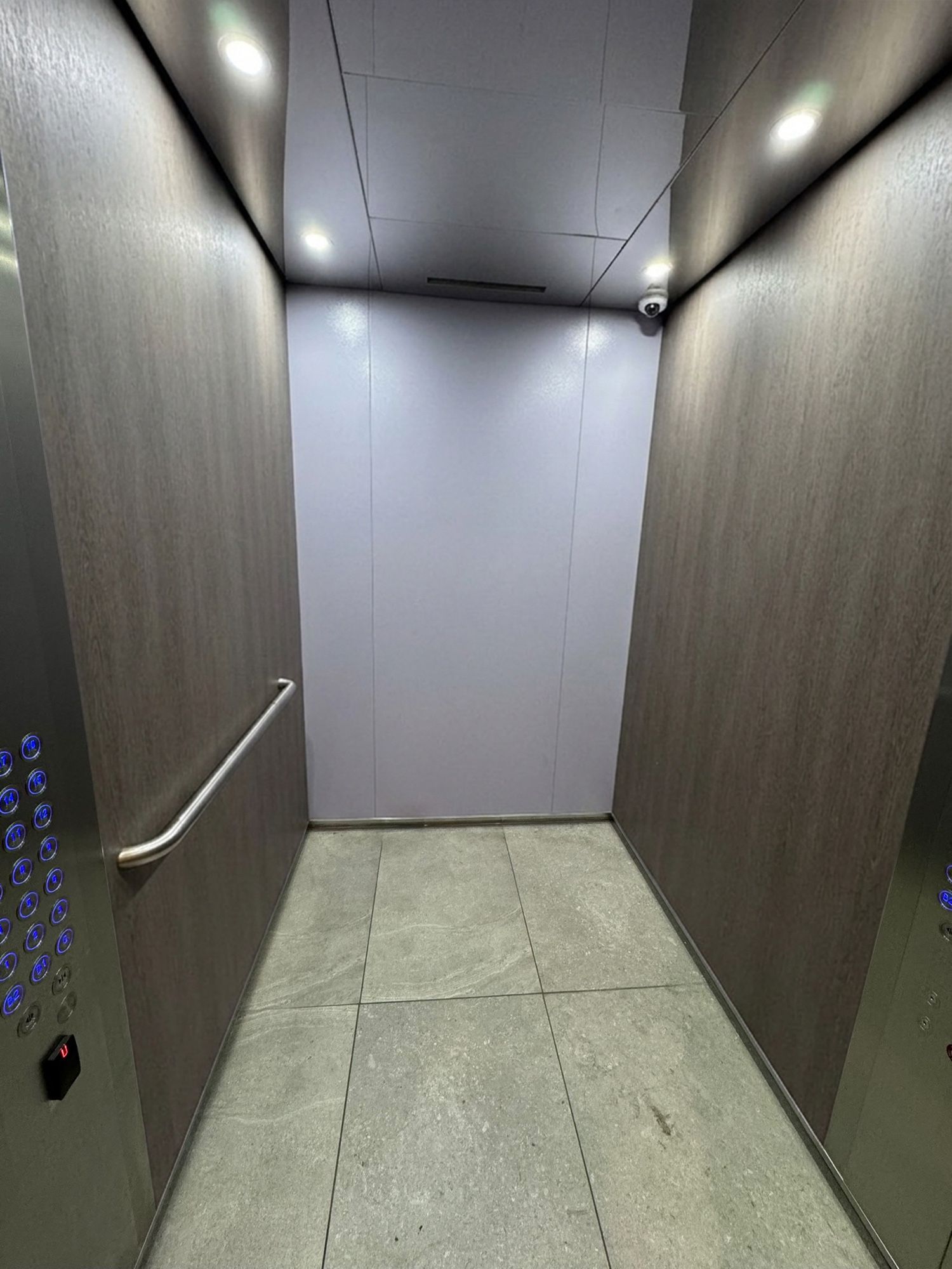 After: Lift car side walls, grey to woodgrain